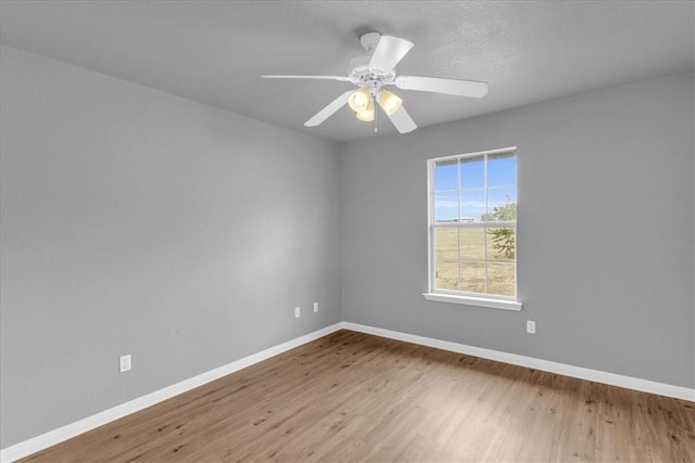 unfurnished room featuring ceiling fan and light wood-type flooring