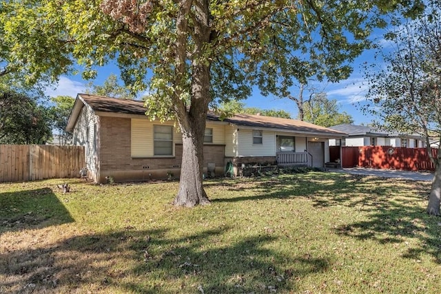 rear view of property featuring a yard