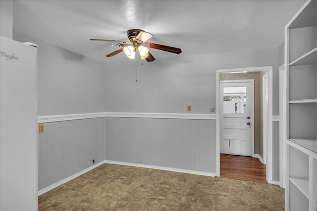 unfurnished room featuring ceiling fan