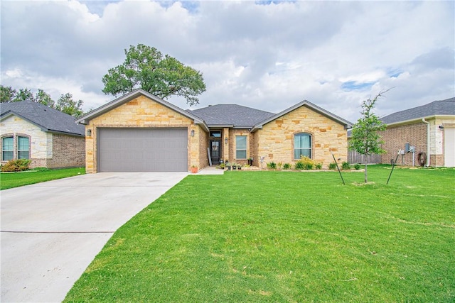 single story home featuring a garage and a front lawn