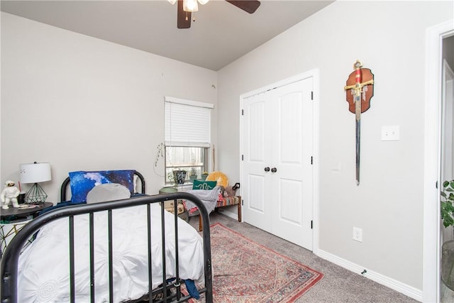 bedroom with ceiling fan, a closet, and carpet