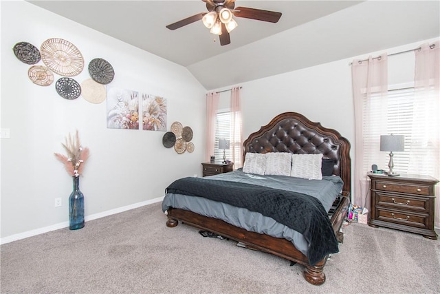 bedroom with lofted ceiling, ceiling fan, and carpet flooring