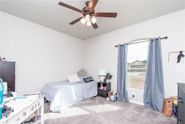 bedroom with light carpet and ceiling fan