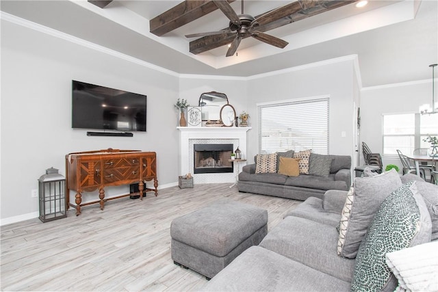 living room featuring crown molding, ceiling fan with notable chandelier, beam ceiling, and light wood-type flooring