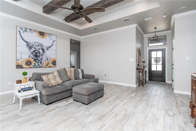 living room featuring crown molding, ceiling fan, light hardwood / wood-style floors, and a tray ceiling