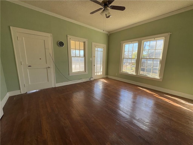 empty room with ornamental molding, a healthy amount of sunlight, ceiling fan, and a textured ceiling