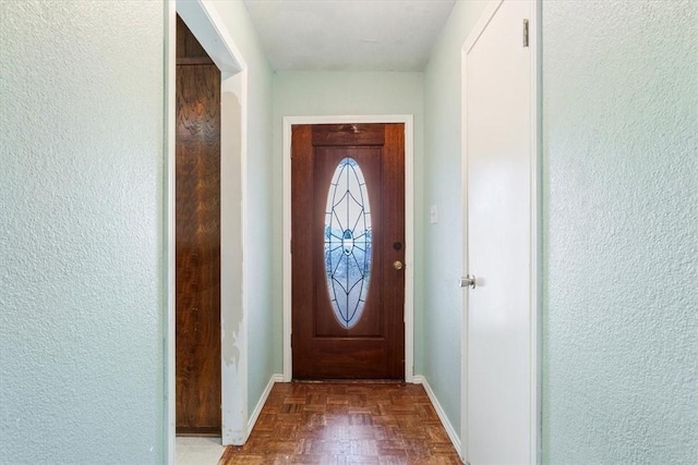 doorway featuring parquet floors