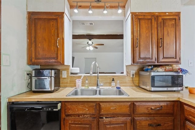 kitchen featuring ceiling fan, beam ceiling, sink, and black dishwasher