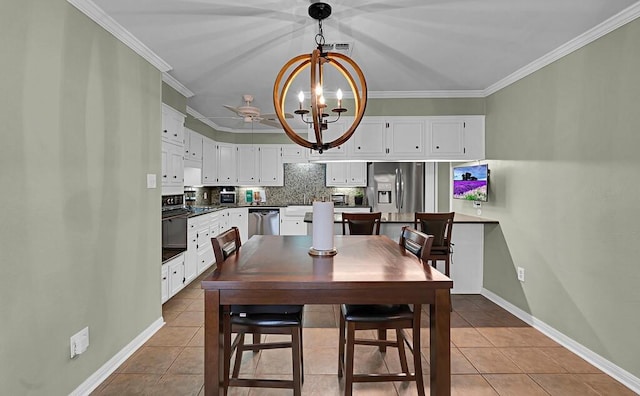 dining room featuring tile patterned floors, baseboards, an inviting chandelier, and ornamental molding