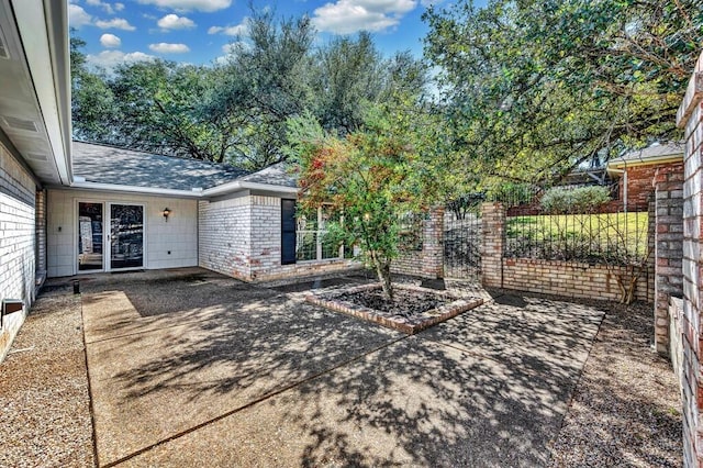 exterior space with a patio area and fence