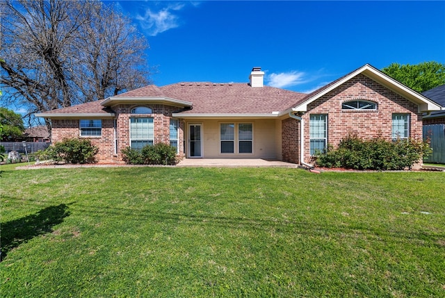 ranch-style home featuring a front yard