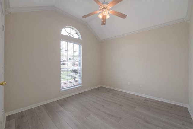 spare room with ceiling fan, light hardwood / wood-style floors, lofted ceiling, and ornamental molding