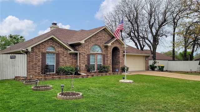 view of front of home with a front yard and a garage