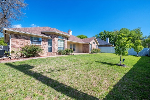 ranch-style house with a front lawn and central air condition unit