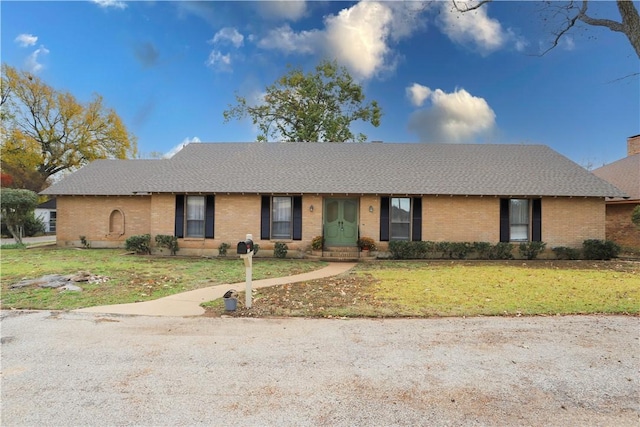 ranch-style house with a front yard