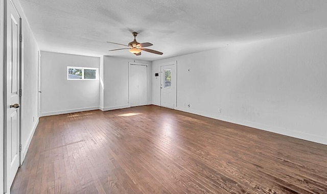 spare room featuring a textured ceiling, dark hardwood / wood-style flooring, and ceiling fan