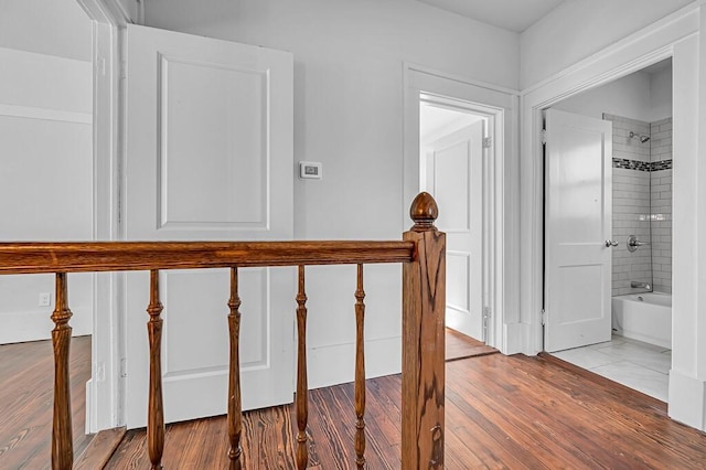 staircase featuring wood-type flooring