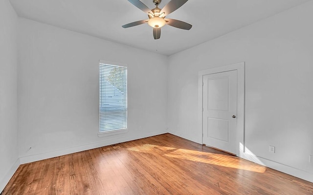 spare room featuring ceiling fan and light wood-type flooring