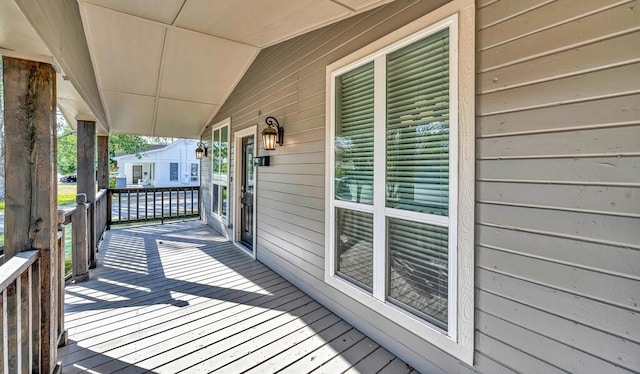 wooden terrace featuring a porch