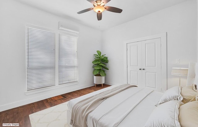 bedroom with ceiling fan, a closet, and dark hardwood / wood-style floors