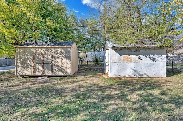 view of outbuilding with a yard