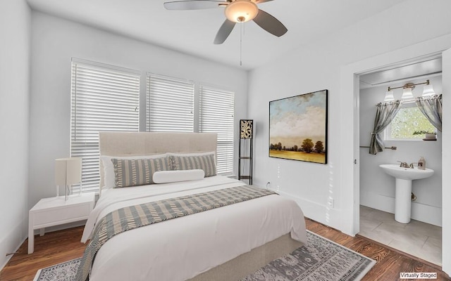 bedroom with hardwood / wood-style floors and ceiling fan