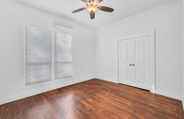 unfurnished room featuring dark hardwood / wood-style floors and ceiling fan