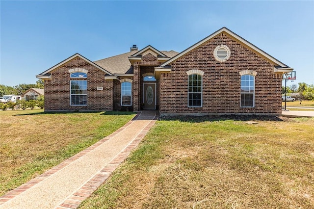 front facade with a front yard