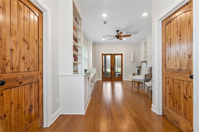 interior space with french doors and wood-type flooring