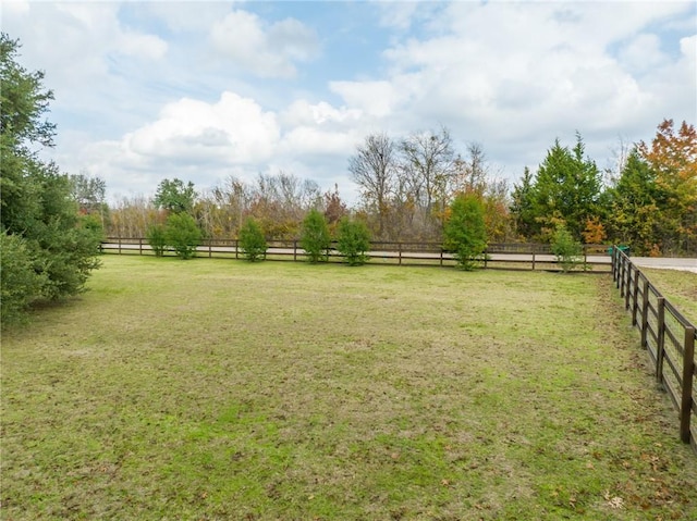 view of yard with a rural view