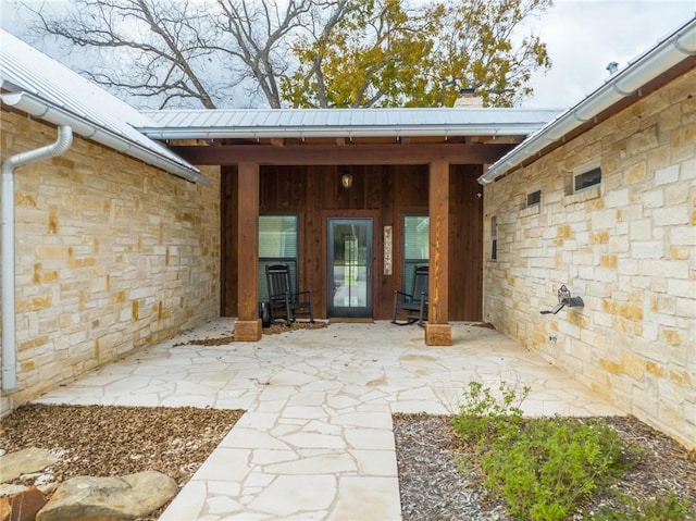 doorway to property featuring a patio