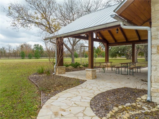 view of home's community with a gazebo, a patio area, and a yard