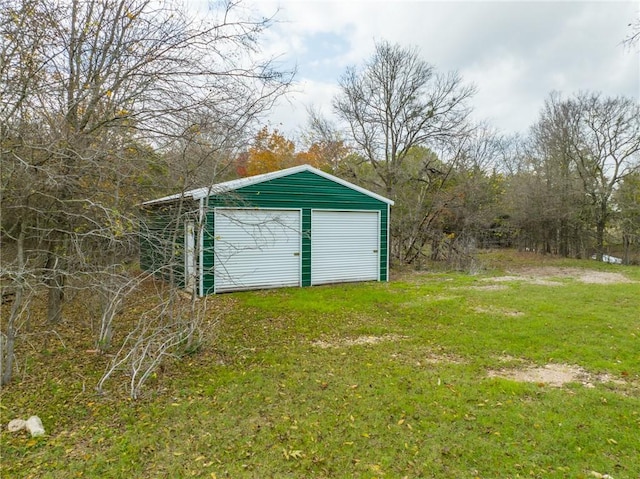 view of outbuilding featuring a garage