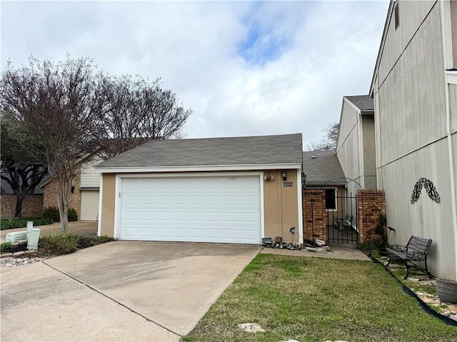 garage with a lawn