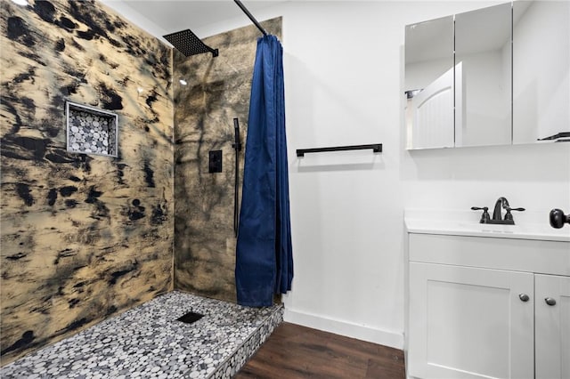 bathroom with hardwood / wood-style floors, vanity, and a shower with shower curtain