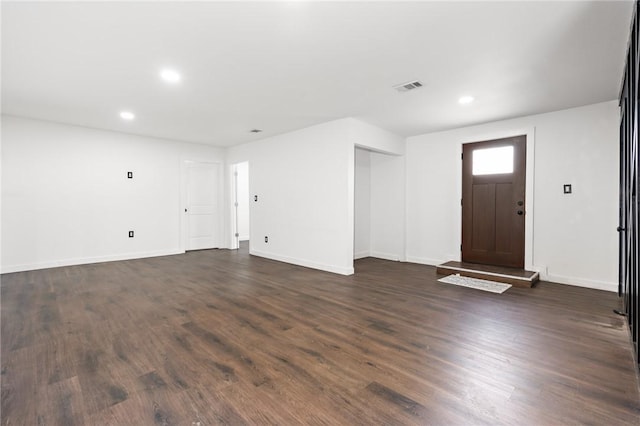 foyer with dark hardwood / wood-style floors