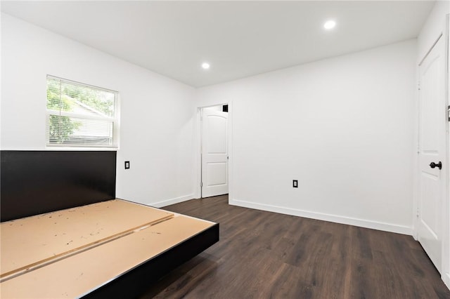 bedroom featuring dark hardwood / wood-style floors