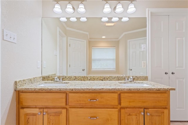 bathroom with vanity and ornamental molding