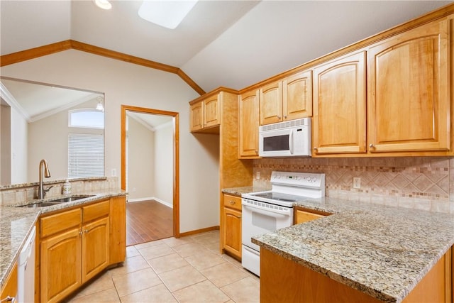 kitchen featuring light stone counters, ornamental molding, white appliances, sink, and lofted ceiling