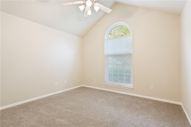 spare room featuring ceiling fan, lofted ceiling, and carpet floors