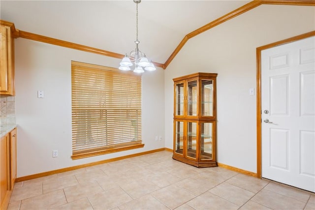 unfurnished dining area featuring a notable chandelier, ornamental molding, light tile patterned floors, and vaulted ceiling