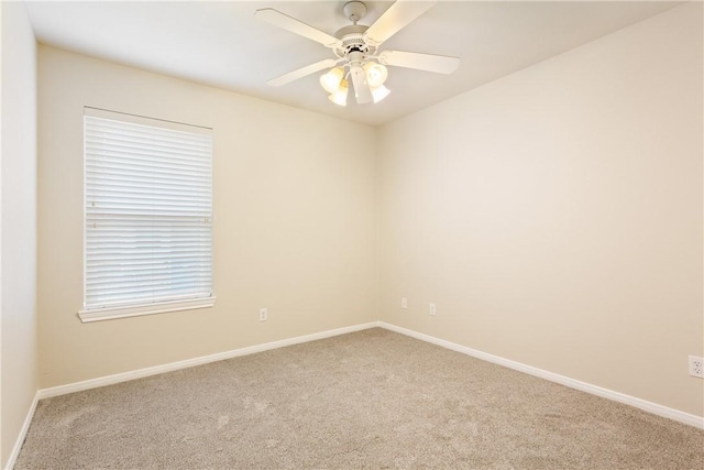 unfurnished room with carpet flooring and ceiling fan