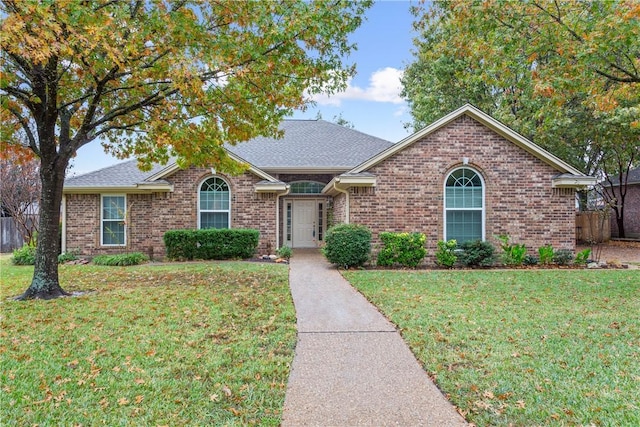 ranch-style home with a front yard