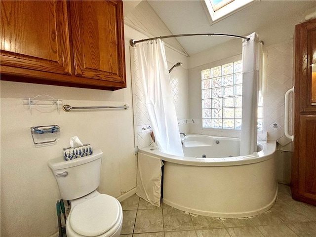 bathroom featuring toilet, shower / tub combo, vaulted ceiling with skylight, and tile patterned floors