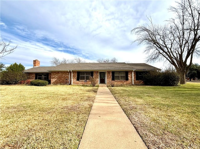 ranch-style house with a front lawn