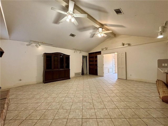 unfurnished living room with ceiling fan, vaulted ceiling with beams, and light tile patterned floors