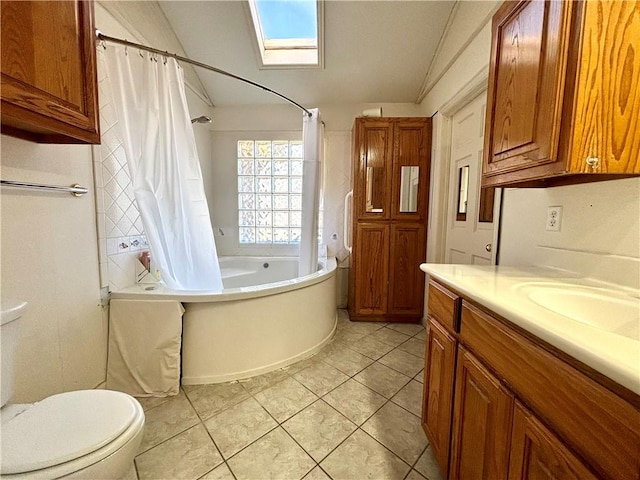 full bathroom featuring toilet, shower / bath combo, tile patterned floors, vaulted ceiling with skylight, and vanity