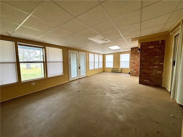 unfurnished room featuring a paneled ceiling