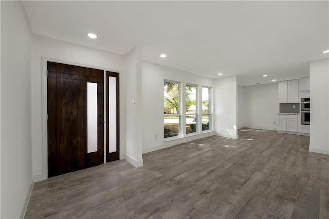 foyer entrance with light hardwood / wood-style flooring