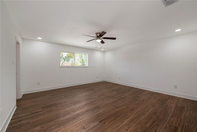 unfurnished room with ceiling fan and dark hardwood / wood-style floors